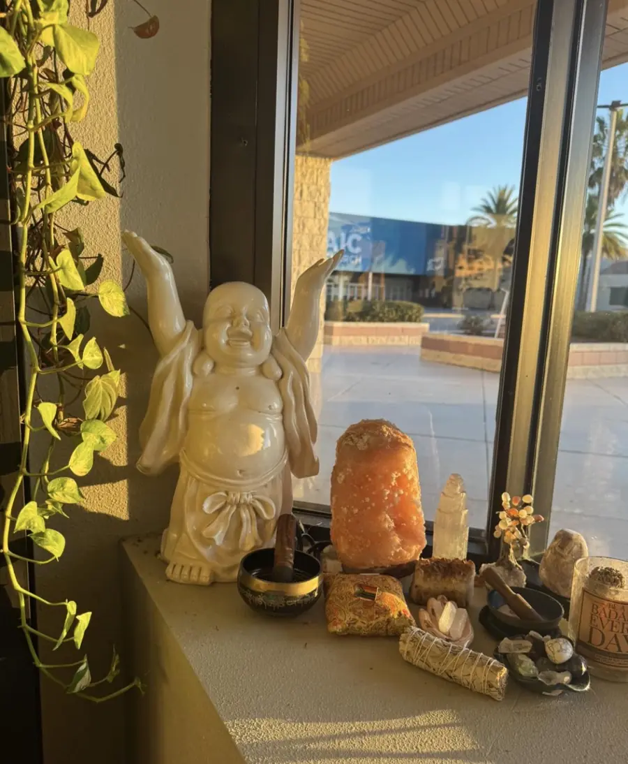 Buddha statue and crystals on the studio windowsill